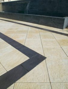 limestone pavers with charcoal border infill