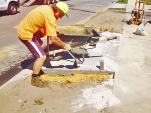council crossover strip footing to paved edges