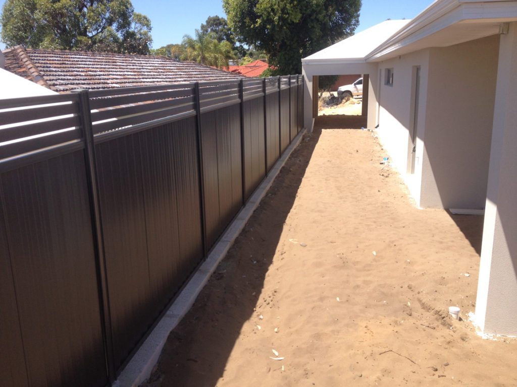 retaining wall with colorbond fence on top
