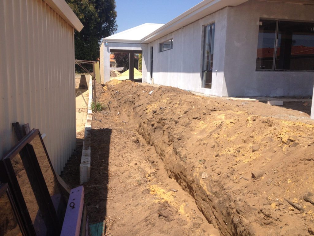 retaining wall with colorbond fence on top