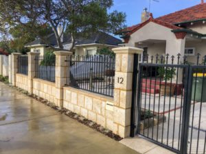 Reconstituted limestone block wall with infills Swanbourne built in letterbox