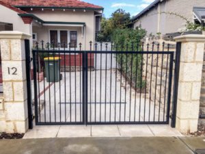 Reconstituted limestone block wall with infills Swanbourne gates