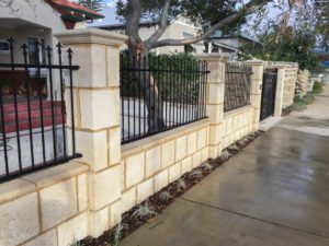 Reconstituted limestone block wall with infills Swanbourne