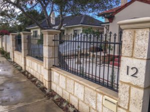 Reconstituted limestone block wall with infills Swanbourne