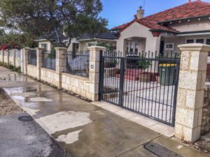 Reconstituted limestone block wall with infills Swanbourne bullnose capping