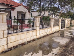 Reconstituted limestone block wall with infills Swanbourne