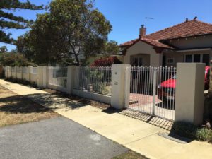 Reconstituted limestone block wall with infills Swanbourne before picture