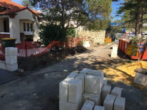 Reconstituted limestone block wall with infills Swanbourne before picture trade contractor