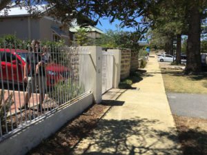 Reconstituted limestone block wall with infills Swanbourne before picture
