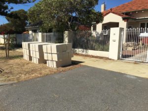 Reconstituted limestone block wall with infills Swanbourne before picture limestone pavers