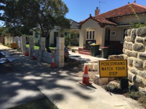 Reconstituted limestone block wall with infills Swanbourne before picture under construction
