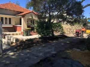 Reconstituted limestone block wall with infills Swanbourne before picture