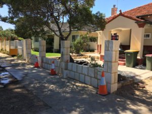 Reconstituted limestone block wall with infills Swanbourne before picture