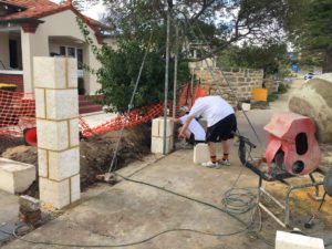 Reconstituted limestone block wall with infills Swanbourne before picture brick layer contractor