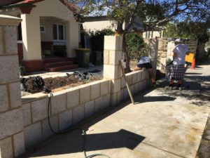 Reconstituted limestone block wall with infills Swanbourne before picture