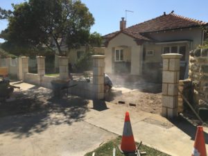 Reconstituted limestone block wall with infills Swanbourne before picture