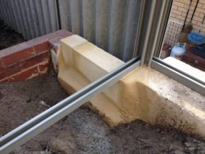 limestone retaining wall colorbond fencing and gates perth