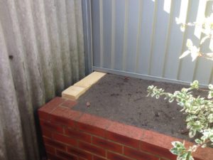 limestone retaining wall colorbond fencing and gates perth